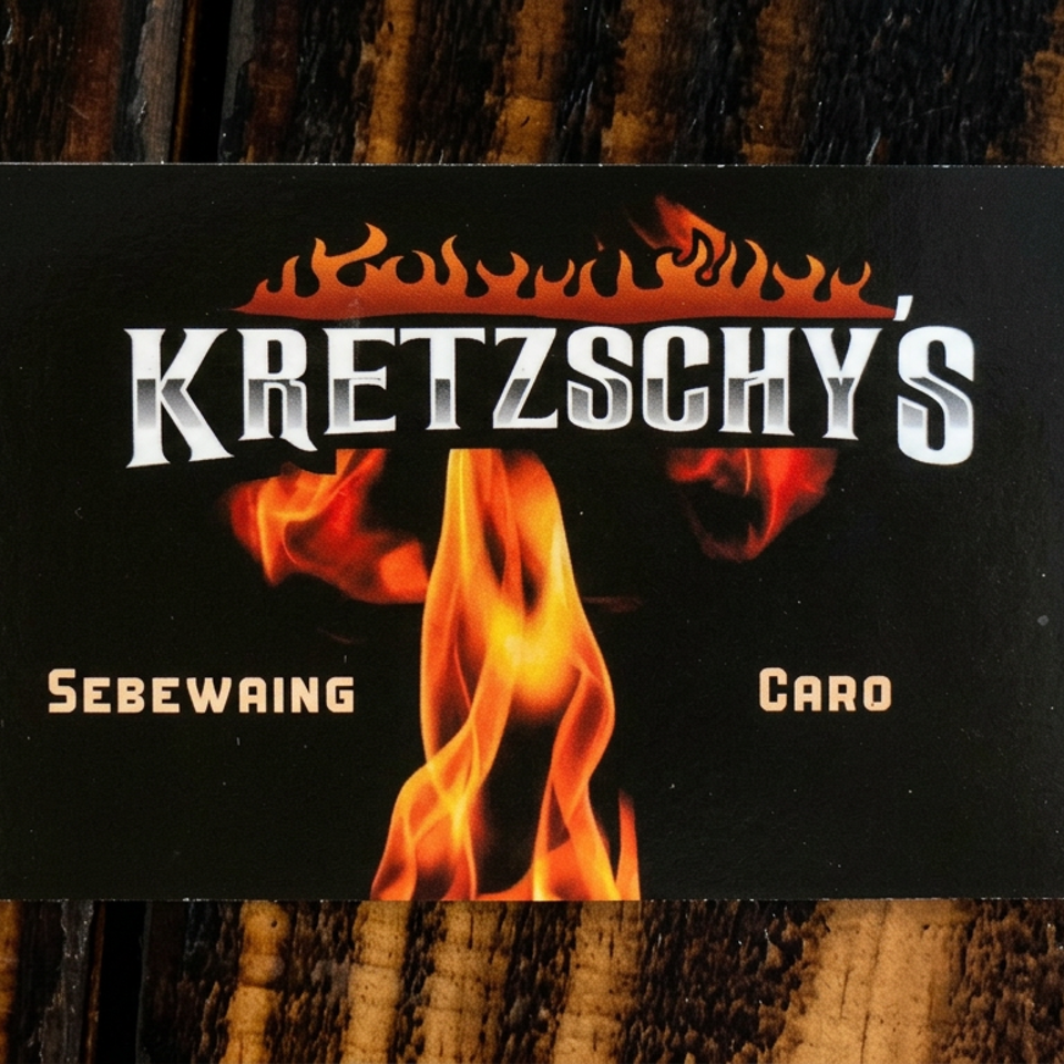 Kretzschy's restaurant sign featuring flames and the words “Sebewäing” and “Caro” on a rustic wooden table.